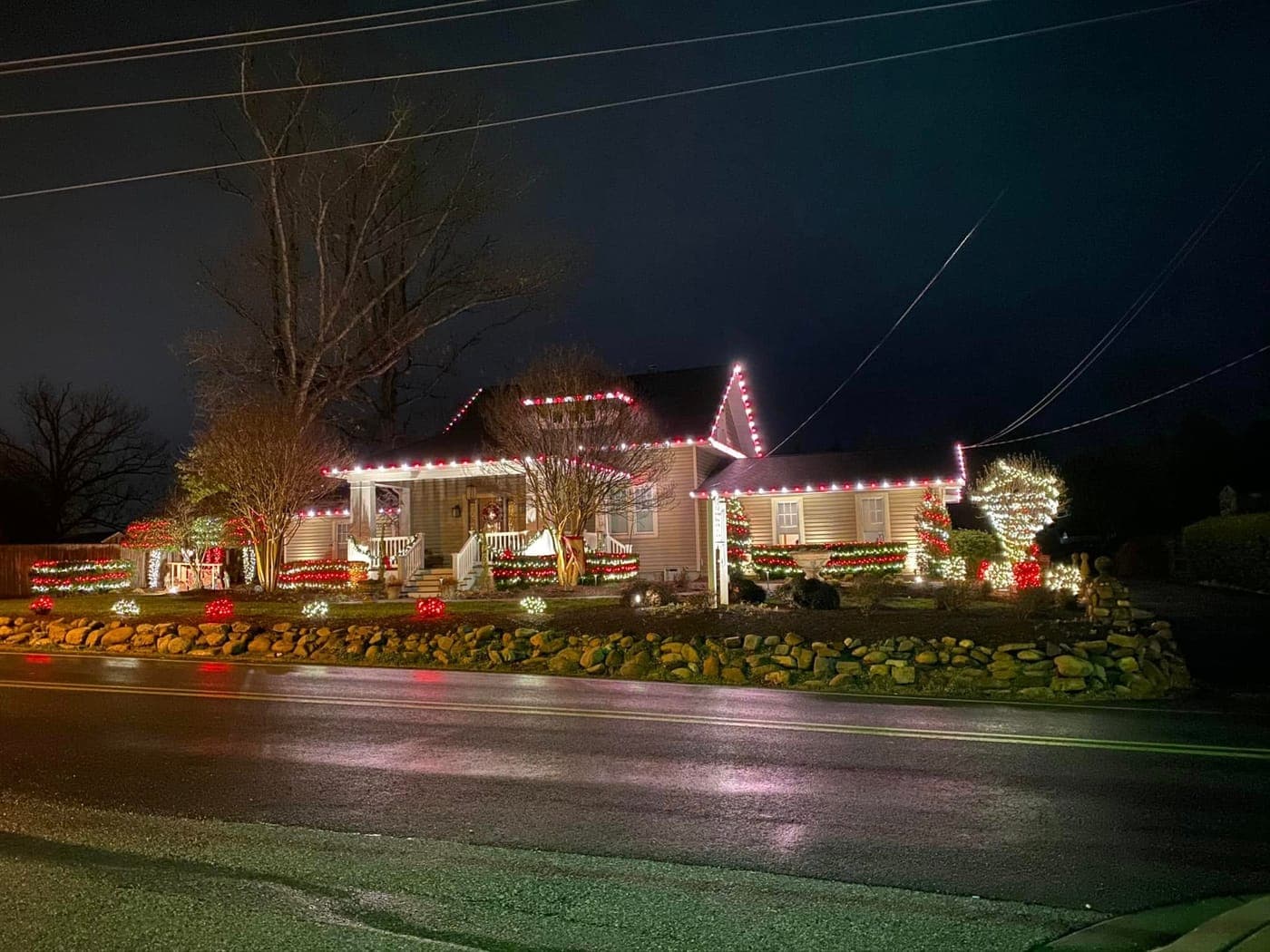 Festive red, white, and green Christmas light display in Calvert County, MD